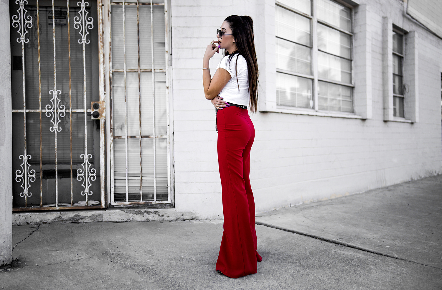 blogger wearing high waisted red pants and white tshirt